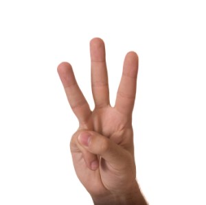 Showing three fingers isolated on white